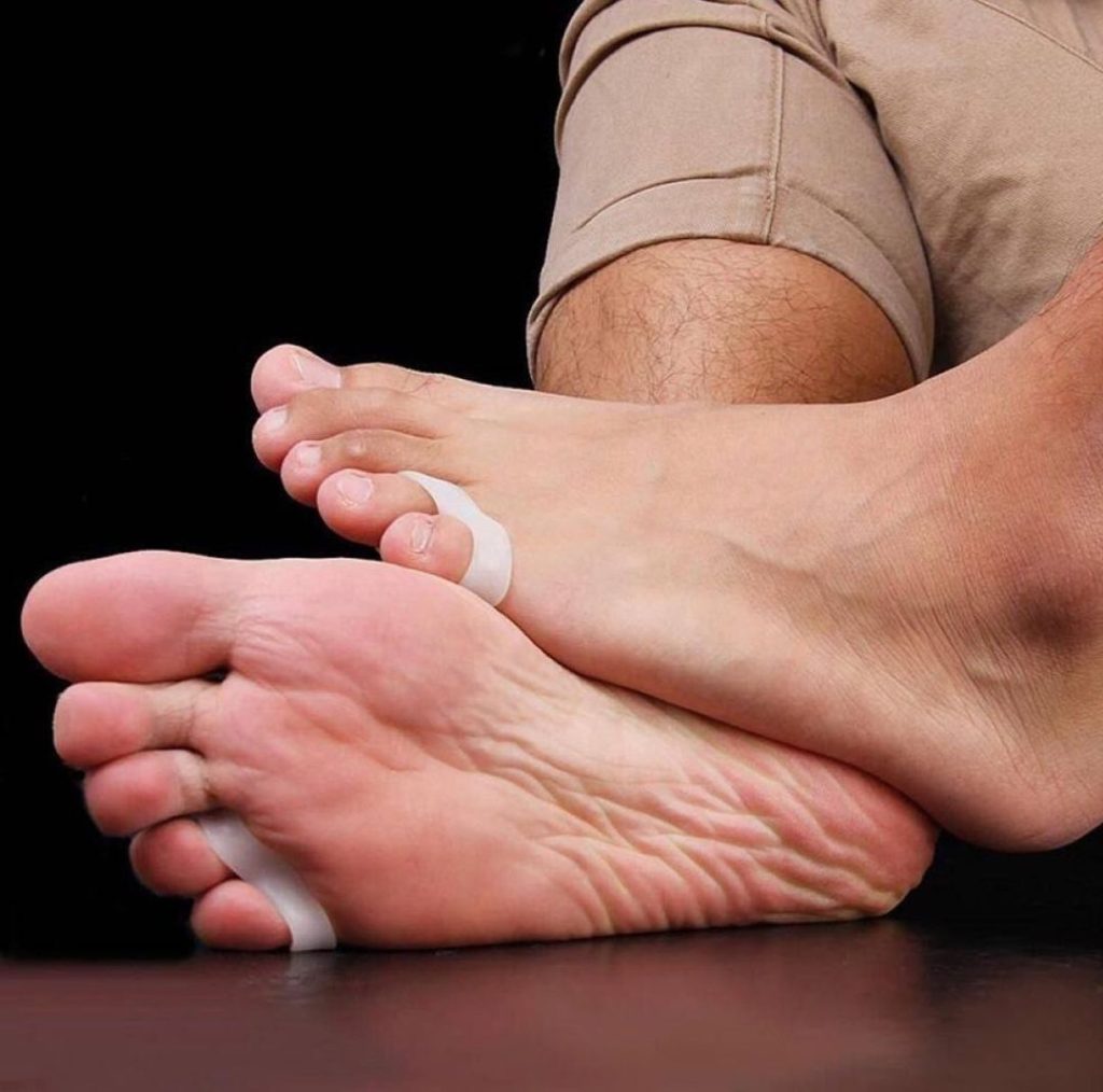 Man wearing individual toe separator on pinky toe.