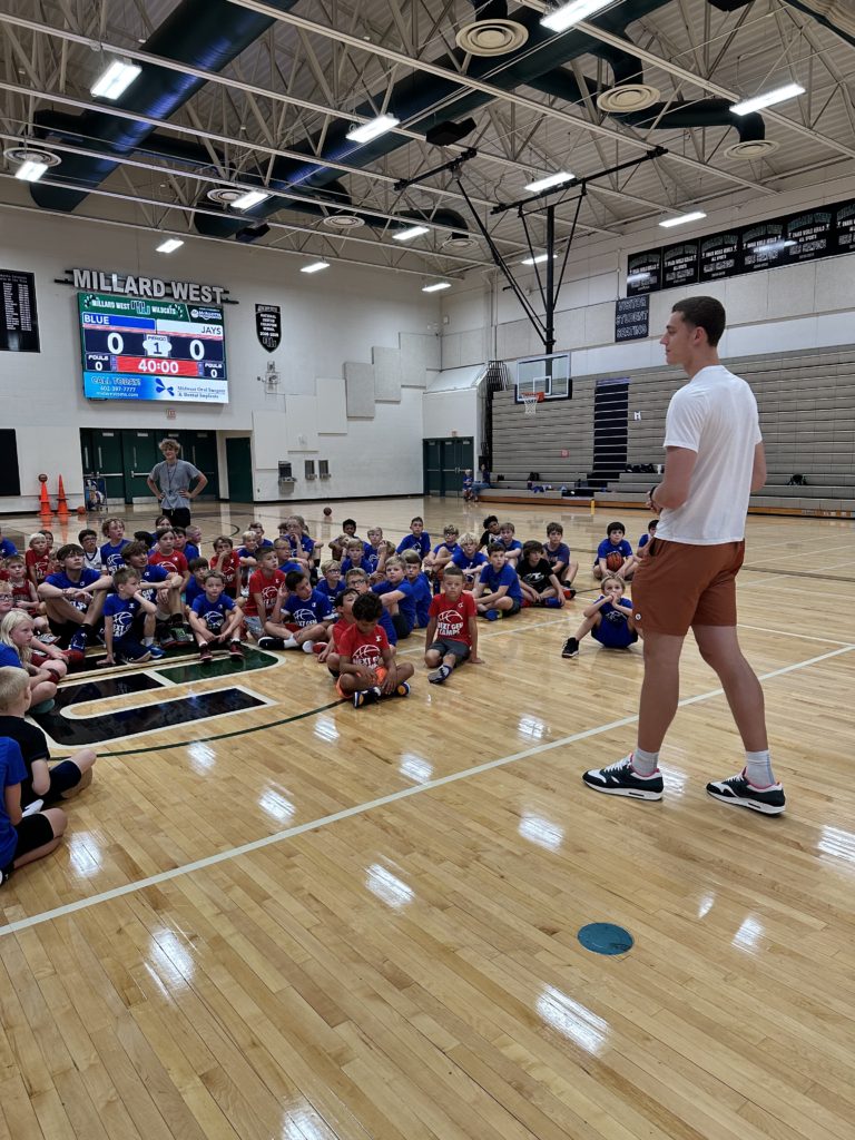 Ryan Kalkbrenner talking to basketball campers at Next Gen basketball camp in Omaha Nebraska.